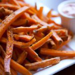 Crispy Baked Sweet Potato Fries with Zesty Sriracha Aioli